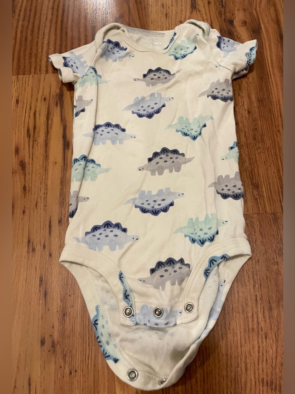 Carter's Cream One-Piece Bodysuit with Blue & Gray Dinosaurs Print